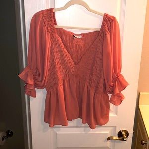 Coral fun spring and summer top! Easy to pair with jeans or wear for a night out